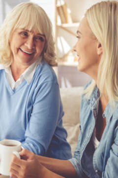 older woman having a conversation with her daughter