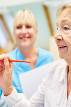 older woman painting canvas 