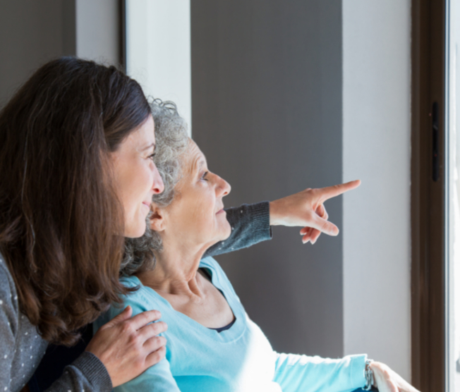 daughter visiting elderly mother