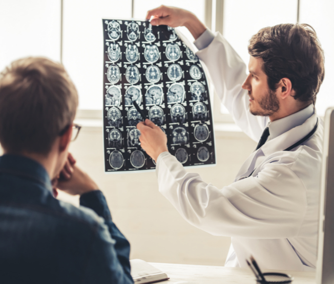 doctor showing patient brain scan