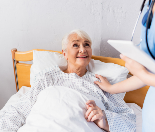 smiling elderly woman in bed