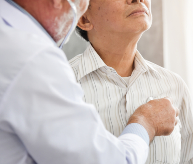 doctor listening to man's breathing