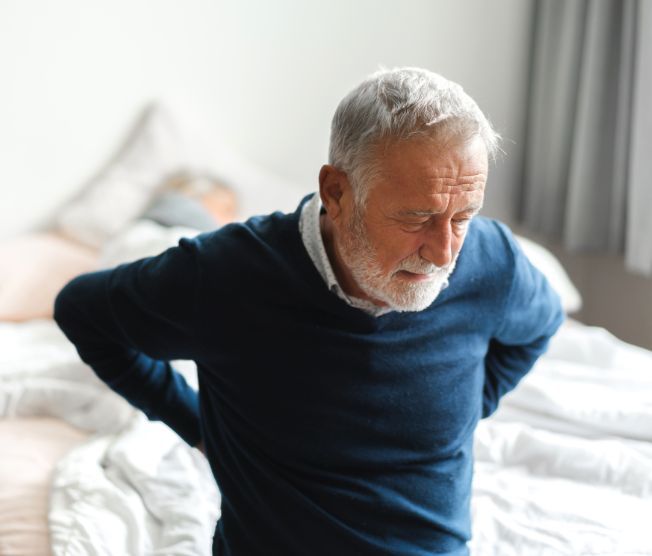 senior adult man with lower back pain